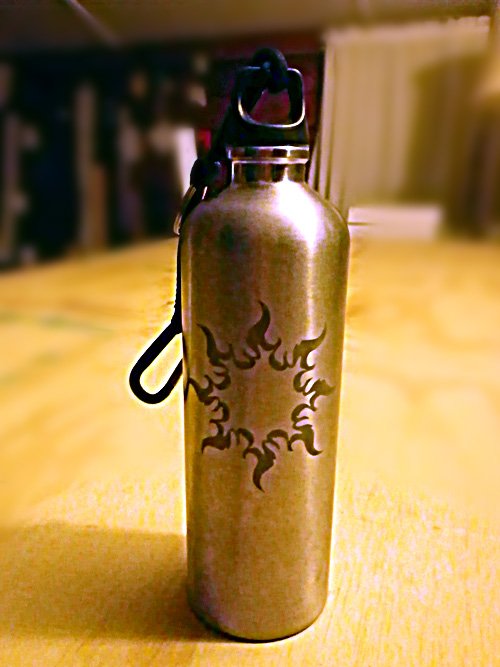 Etching - Jessica Williams' Tribal Sun etched onto a stainless steel water bottle